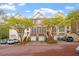 Beautiful brick townhome with a two-car garage, mature trees, and manicured landscaping at 3920 Bentley Brook Dr, Raleigh, NC 27612