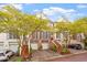 Charming brick townhome with two-car garage, mature trees, and manicured landscaping at 3920 Bentley Brook Dr, Raleigh, NC 27612