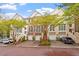 Beautiful brick townhome with a two-car garage, mature trees, and manicured landscaping at 3920 Bentley Brook Dr, Raleigh, NC 27612