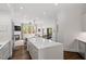 A spacious kitchen with modern appliances, a large center island, and views to the living room at 3920 Bentley Brook Dr, Raleigh, NC 27612