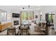 Bright living room featuring a fireplace, large windows, and hardwood floors at 3920 Bentley Brook Dr, Raleigh, NC 27612