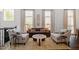 Bright living room with hardwood floors, neutral decor, and large windows at 3920 Bentley Brook Dr, Raleigh, NC 27612