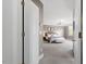 Spacious main bedroom with a large bed, chandelier, and ample natural light at 3920 Bentley Brook Dr, Raleigh, NC 27612