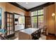 Well-lit office with french doors has stylish decor and ample space for working at 3920 Bentley Brook Dr, Raleigh, NC 27612