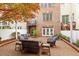 Outdoor patio with comfortable seating, a brick surround, and mature trees at 3920 Bentley Brook Dr, Raleigh, NC 27612