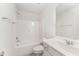 Pristine white bathroom featuring a shower-tub combo and modern vanity at 4005 Sierra Pelona Dr, Raleigh, NC 27616