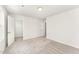 Bright and spacious bedroom with soft carpet, white walls and multiple doors at 4005 Sierra Pelona Dr, Raleigh, NC 27616
