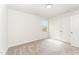 Bedroom with plush neutral carpet, bright white walls, and window view at 4005 Sierra Pelona Dr, Raleigh, NC 27616