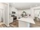Bright kitchen with a center island, stainless steel appliances, and white cabinetry at 4005 Sierra Pelona Dr, Raleigh, NC 27616