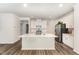 Bright kitchen featuring a center island, stainless steel appliances and pendant lighting at 4005 Sierra Pelona Dr, Raleigh, NC 27616