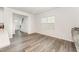 Bright living room with views to the entry hall, staircase and large window at 4005 Sierra Pelona Dr, Raleigh, NC 27616