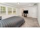 Spacious main bedroom with plush carpet, recessed lights, and a view to the ensuite bathroom at 4005 Sierra Pelona Dr, Raleigh, NC 27616