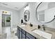 Modern bathroom featuring double sinks, stylish mirrors, and sleek fixtures at 416 Glenview Ln, Durham, NC 27703