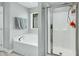 Bathroom featuring a soaking tub and walk-in shower at 416 Glenview Ln, Durham, NC 27703