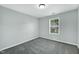 Bedroom with carpeted floor and a window at 416 Glenview Ln, Durham, NC 27703