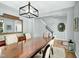 Spacious dining room featuring a large dining table, modern lighting fixture, and elegant decor accents at 416 Glenview Ln, Durham, NC 27703