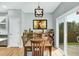Cozy dining area featuring a wooden table, art display shelf, sliding door access to the outdoors at 416 Glenview Ln, Durham, NC 27703