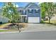 Charming two-story home featuring a two-car garage, well-maintained landscaping, and inviting curb appeal at 416 Glenview Ln, Durham, NC 27703