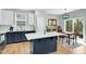 Well-equipped kitchen with an island, modern appliances, and dining area for casual meals and entertaining at 416 Glenview Ln, Durham, NC 27703