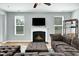 Bright living room with a fireplace, hardwood floors, and comfortable seating at 416 Glenview Ln, Durham, NC 27703
