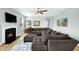 Comfortable living room featuring a fireplace, plush sectional sofa, and a relaxing ambiance for gatherings at 416 Glenview Ln, Durham, NC 27703