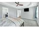 Bright main bedroom with a ceiling fan and access to an ensuite bathroom at 416 Glenview Ln, Durham, NC 27703