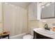 Bright bathroom with a shower-tub combination, vanity, and neutral color scheme at 431 Waddill St, Henderson, NC 27536
