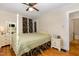 Cozy bedroom with a four-poster bed, hardwood floors, and ample natural light, creating a serene retreat at 431 Waddill St, Henderson, NC 27536