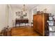Dining area showcasing vintage furnishings, a window, and a chandelier for a warm and inviting atmosphere at 431 Waddill St, Henderson, NC 27536