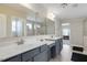 Bathroom with dual sinks, a large mirror, and a separate shower and tub, designed for comfort at 46 Twelve Oaks Dr, Willow Springs, NC 27592