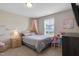 Bedroom decorated with a canopy bed, a dollhouse, and a unicorn painting, ideal for a  at 46 Twelve Oaks Dr, Willow Springs, NC 27592