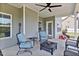 Relaxing covered patio featuring comfortable seating, a fire pit, and a ceiling fan at 46 Twelve Oaks Dr, Willow Springs, NC 27592