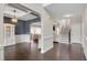 Elegant dining room with dark hardwood floors, white wainscoting, and coffered ceilings at 46 Twelve Oaks Dr, Willow Springs, NC 27592