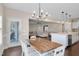 Dining room leading to the kitchen and living room with natural light at 46 Twelve Oaks Dr, Willow Springs, NC 27592