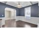 Formal dining room boasting rich blue walls, trim accents, and hardwood floors at 46 Twelve Oaks Dr, Willow Springs, NC 27592