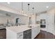 Kitchen island view showcasing the open layout to the living room and dining area at 46 Twelve Oaks Dr, Willow Springs, NC 27592
