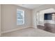 Comfortable carpeted room with a view of the dining room featuring dark hardwood floors at 46 Twelve Oaks Dr, Willow Springs, NC 27592