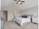 Spacious main bedroom with neutral walls, carpet flooring, and multiple windows for natural light at 46 Twelve Oaks Dr, Willow Springs, NC 27592