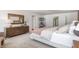 Bright bedroom with a wooden dresser, a cozy bed, stylish decor, and plenty of natural light at 494 Lochalsh Dr, Gibsonville, NC 27249