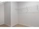 Walk-in closet with carpeted floor and a wire shelf for clothing storage at 494 Lochalsh Dr, Gibsonville, NC 27249