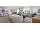 Open concept living space with kitchen island, dining area, comfortable seating and natural light at 494 Lochalsh Dr, Gibsonville, NC 27249