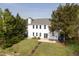 Spacious backyard featuring a well-maintained lawn, patio, and stairs leading to yard for outdoor enjoyment at 512 N Waters Edge Dr, Durham, NC 27703