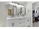 Contemporary bathroom featuring a double vanity with quartz countertops and modern black fixtures at 512 N Waters Edge Dr, Durham, NC 27703
