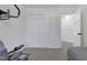 Spacious bedroom with an elliptical machine and a double door closet at 512 N Waters Edge Dr, Durham, NC 27703