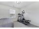 Bedroom featuring an elliptical machine and a window at 512 N Waters Edge Dr, Durham, NC 27703