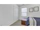 Bright bedroom featuring a double closet and a window at 512 N Waters Edge Dr, Durham, NC 27703