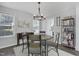 Cozy dining room featuring a round table, stylish lighting, and comfortable seating at 512 N Waters Edge Dr, Durham, NC 27703