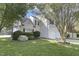 Two-story home with a manicured lawn, flowering shrubs, and attached two-car garage at 512 N Waters Edge Dr, Durham, NC 27703