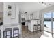 Beautiful, renovated kitchen with barstool seating, stainless appliances, and a sliding glass door with lake views at 512 N Waters Edge Dr, Durham, NC 27703