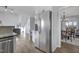 Open-concept kitchen with stainless steel appliances, adjacent to living and dining areas at 512 N Waters Edge Dr, Durham, NC 27703